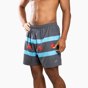 Chi Chi Sport grey athletic shorts with light blue stripes and red stars, featuring a 5-inch inseam and side pockets.