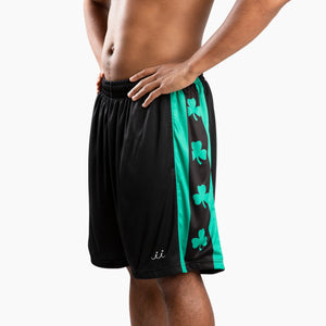 Chi Chi Sport Shamrock basketball shorts in black with green side panels featuring clover patterns and side pockets.