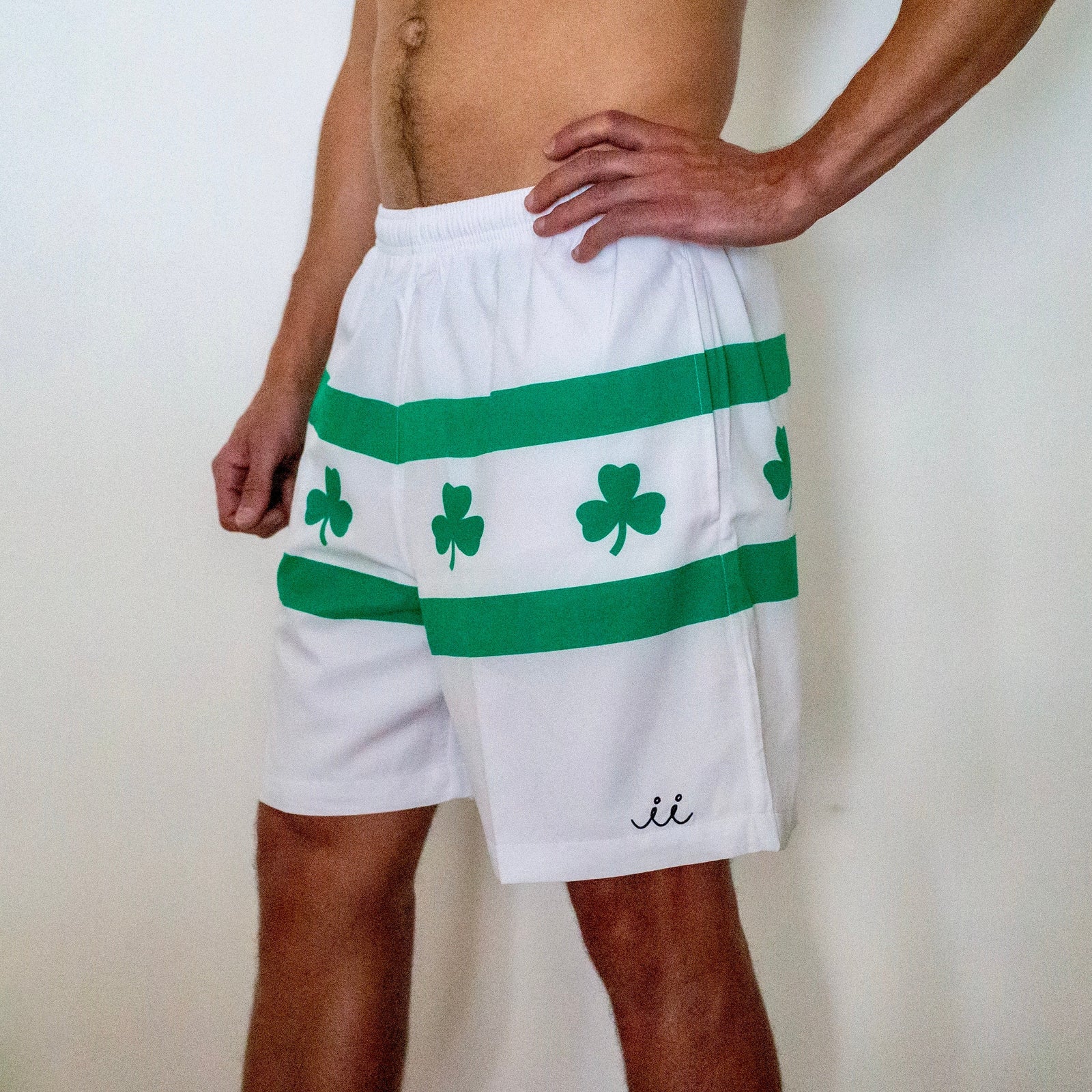 Chi Chi Sport men's white running shorts with green stripes and shamrock print, 7-inch inseam athletic polyester blend
