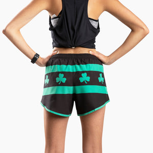 Chi Chi Sport women's running shorts in black and green with shamrock print, featuring built-in briefs and pocket.