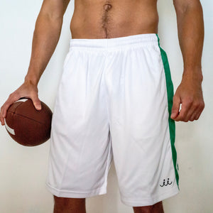 Chi Chi Sport men's white basketball shorts with green side stripes and a 10-inch inseam, worn by a male model.